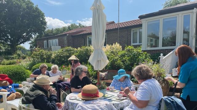 Coombe End Court residents enjoy National Garden Scheme open garden in Manton