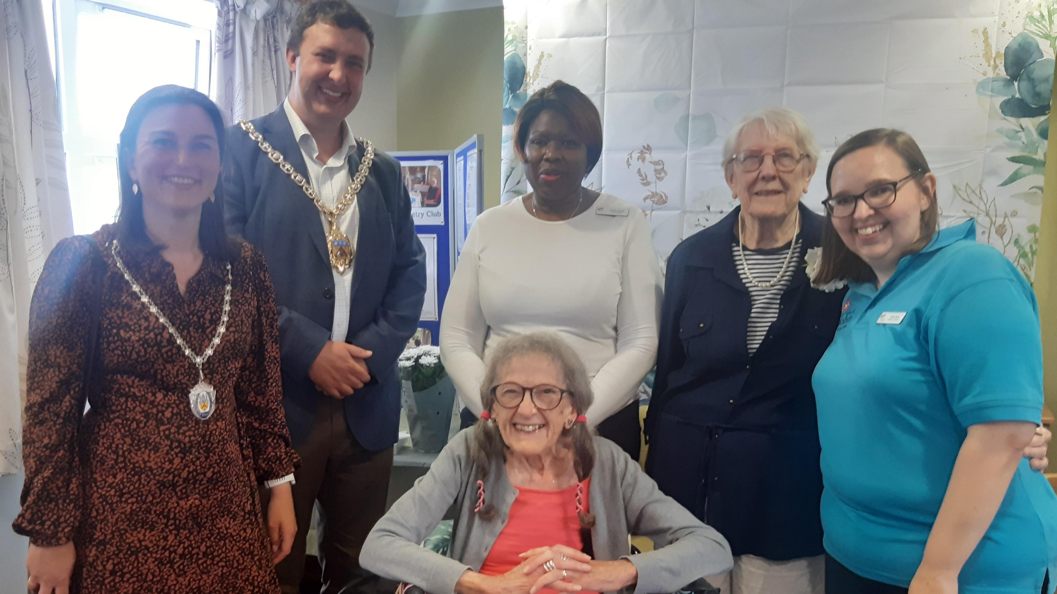 staff and residents meet the Mayor of Cheltenham at poetry book launch