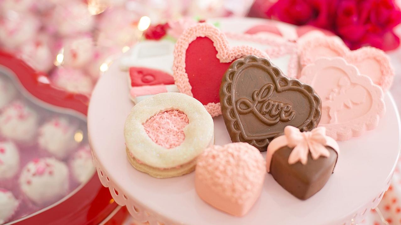 A selection of Valentine's Day chocolates on a cake stand