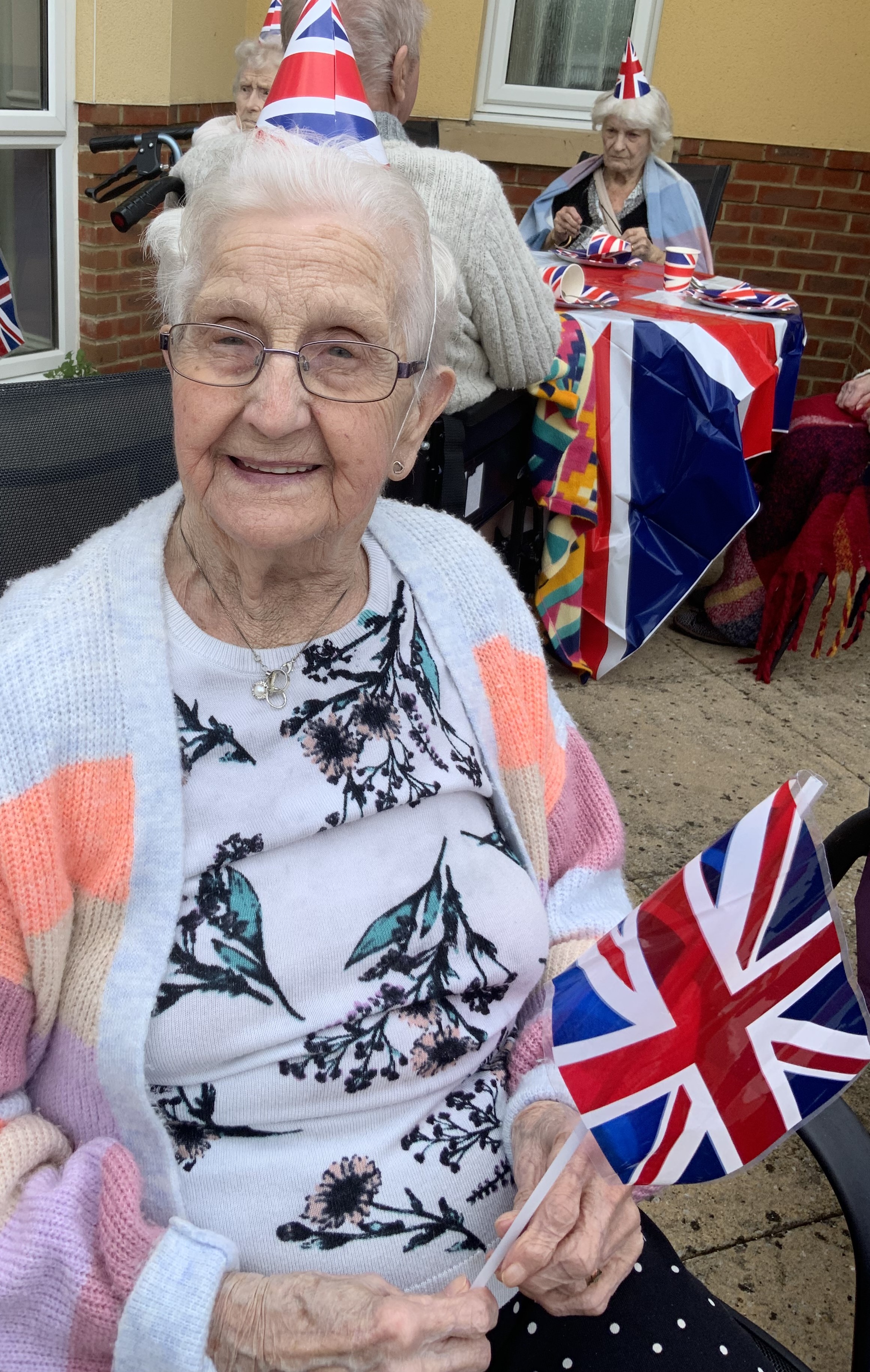 Cecelia, a resident at Larkrise, enjoying the celebrations