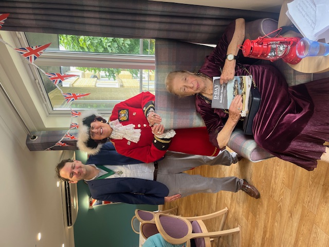 Diana, resident at Madley Park House, with D Day book featuring her article, presented by the Mayor and Town Crier