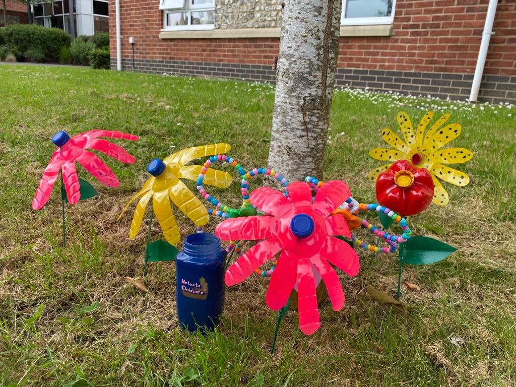 Upcycled flowers in a community art project