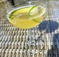 A light sparkling drink with fresh cucumber slices.