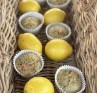 Vegetable muffins and lemons in a wicker basket.