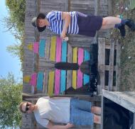 Volunteers with painted butterfly decoration