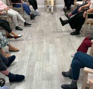 Residents take part in a seated leg exercise class at Edwardstow Court, helping to maintain lower body strength and mobility.
