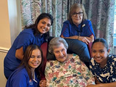 Staff celebrating Muriel's 106th Birthday at Chestnut Court