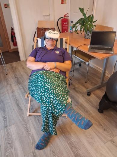 Visitors discovering how technology can bring new experiences into a care setting
