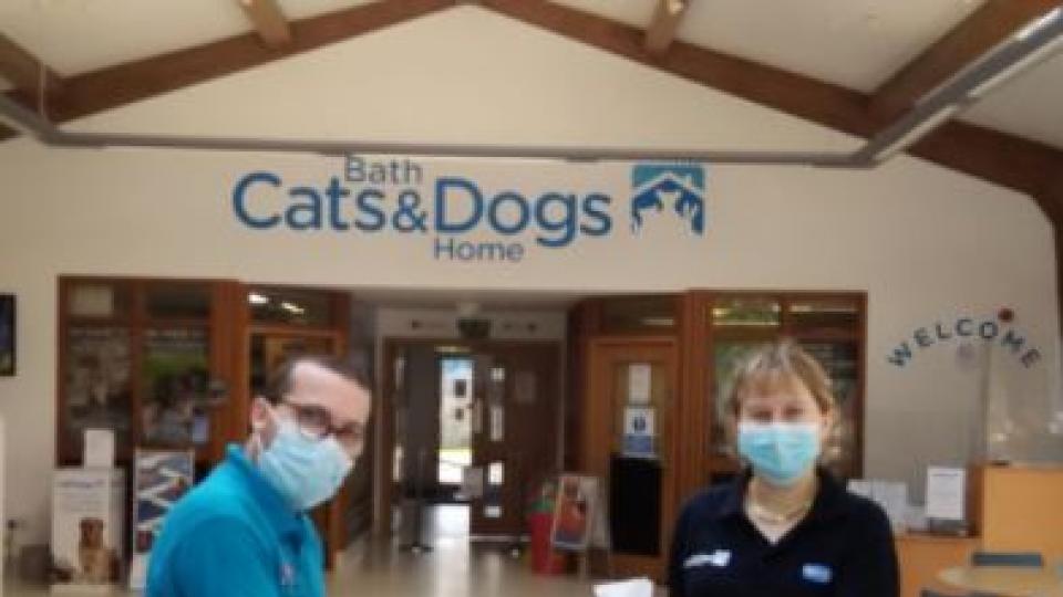 Alex presents dog biscuits