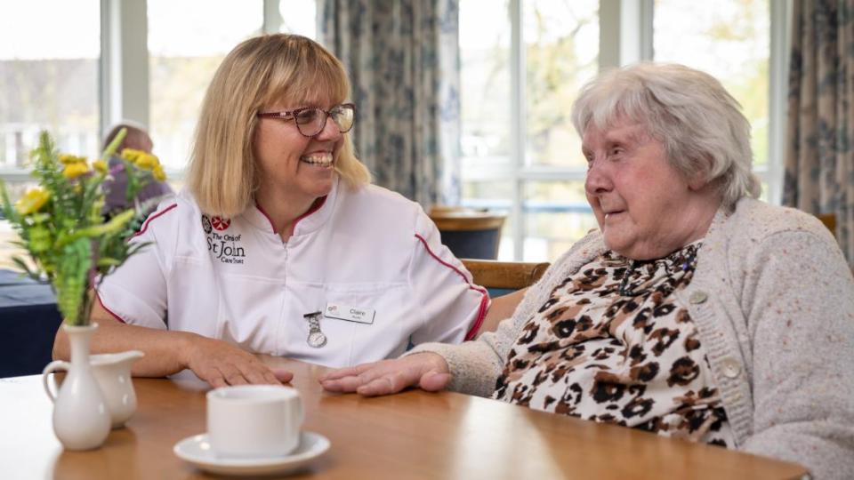 What are the responsibilities and duties of a care worker in a care home?