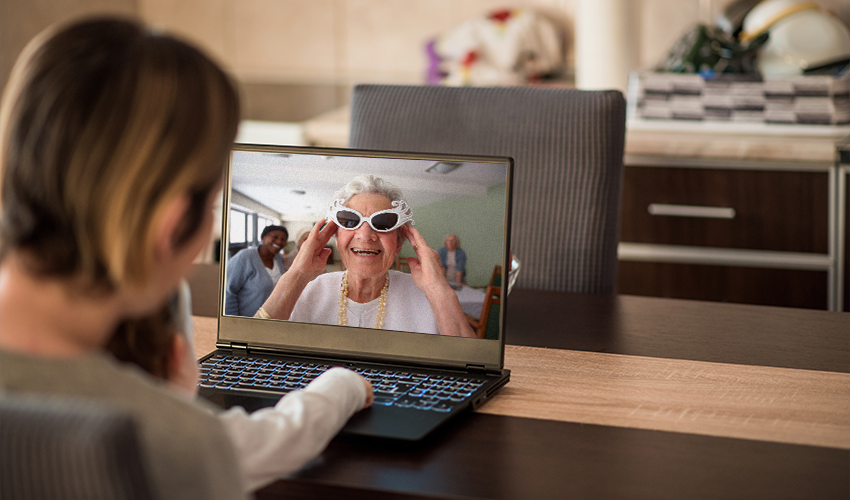 lady and daughter, video call to grandmother