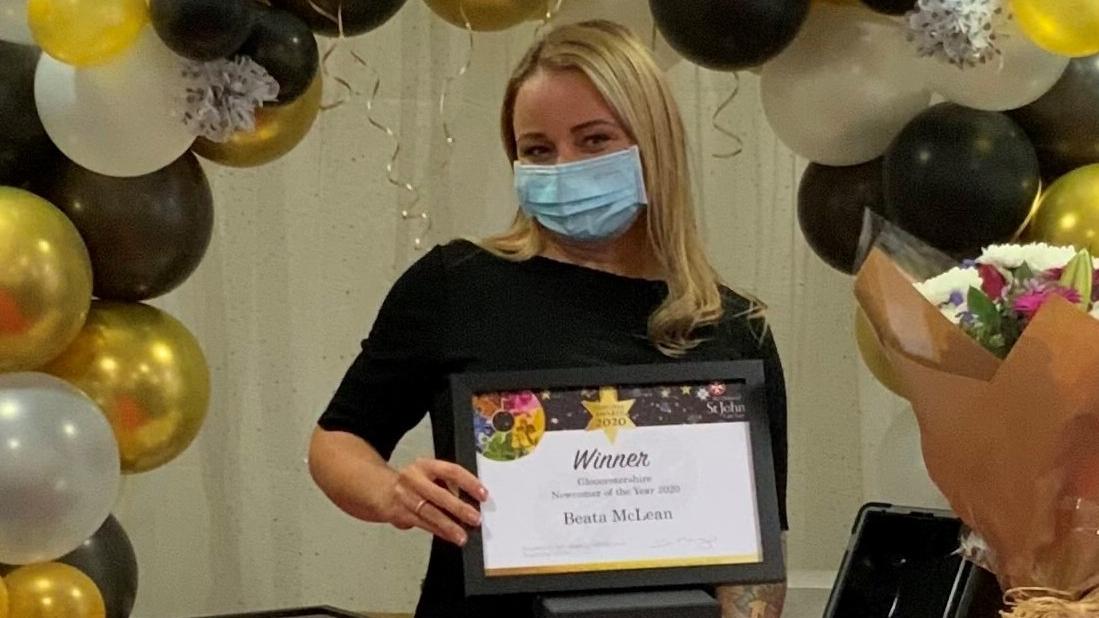 Beata collecting her award