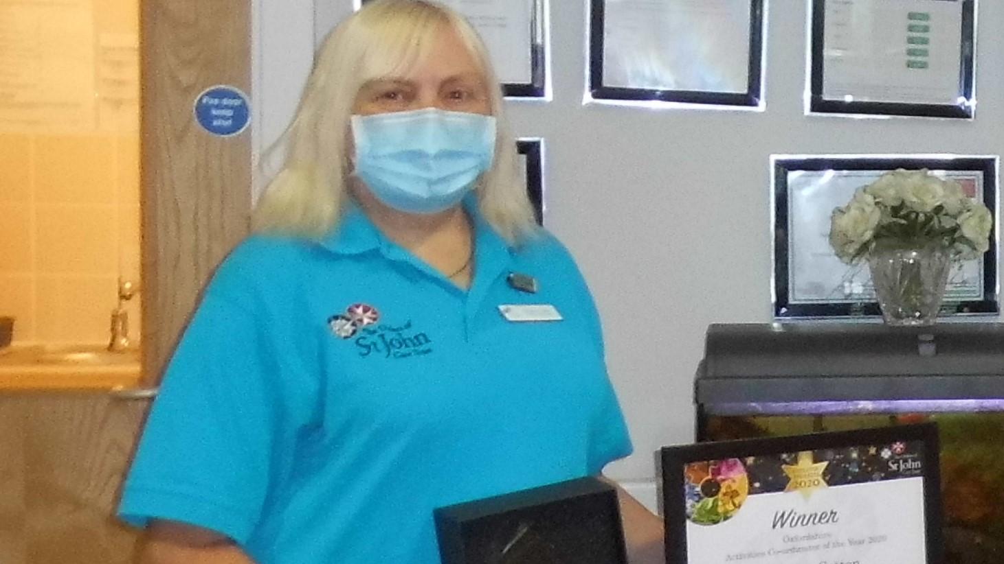 Beverley receiving her Award