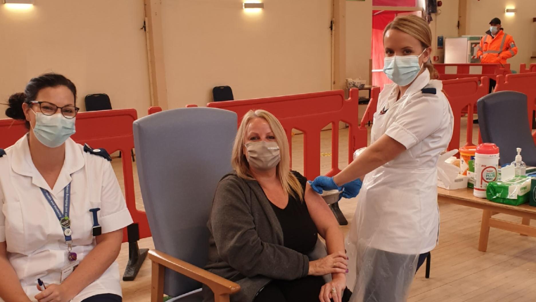 Andrea Brooks, Home Manager at OSJCT Beckside, is pictured having her vaccination 