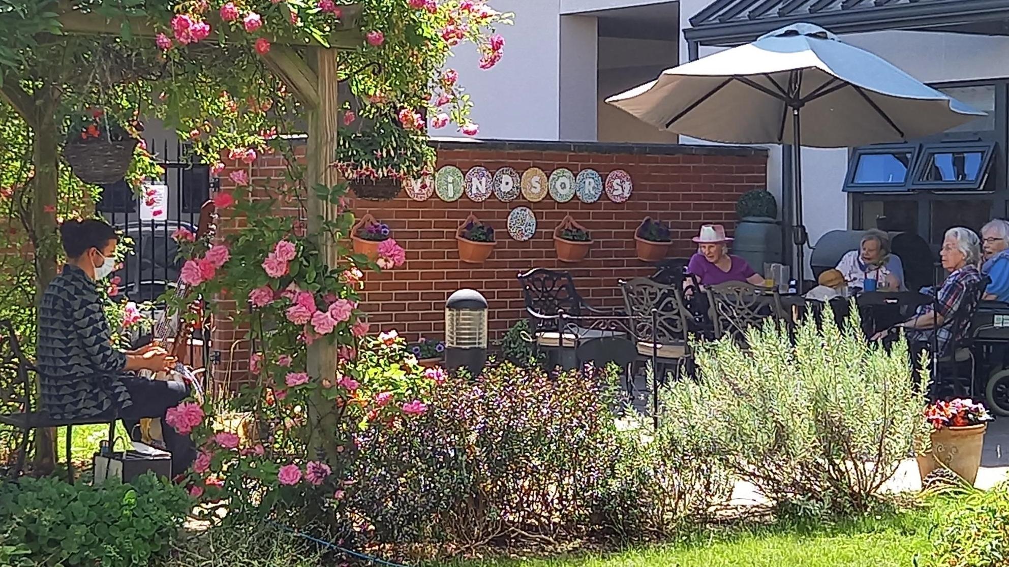 Rudy Green performs for residents in Windsor Street Care Centre's garden