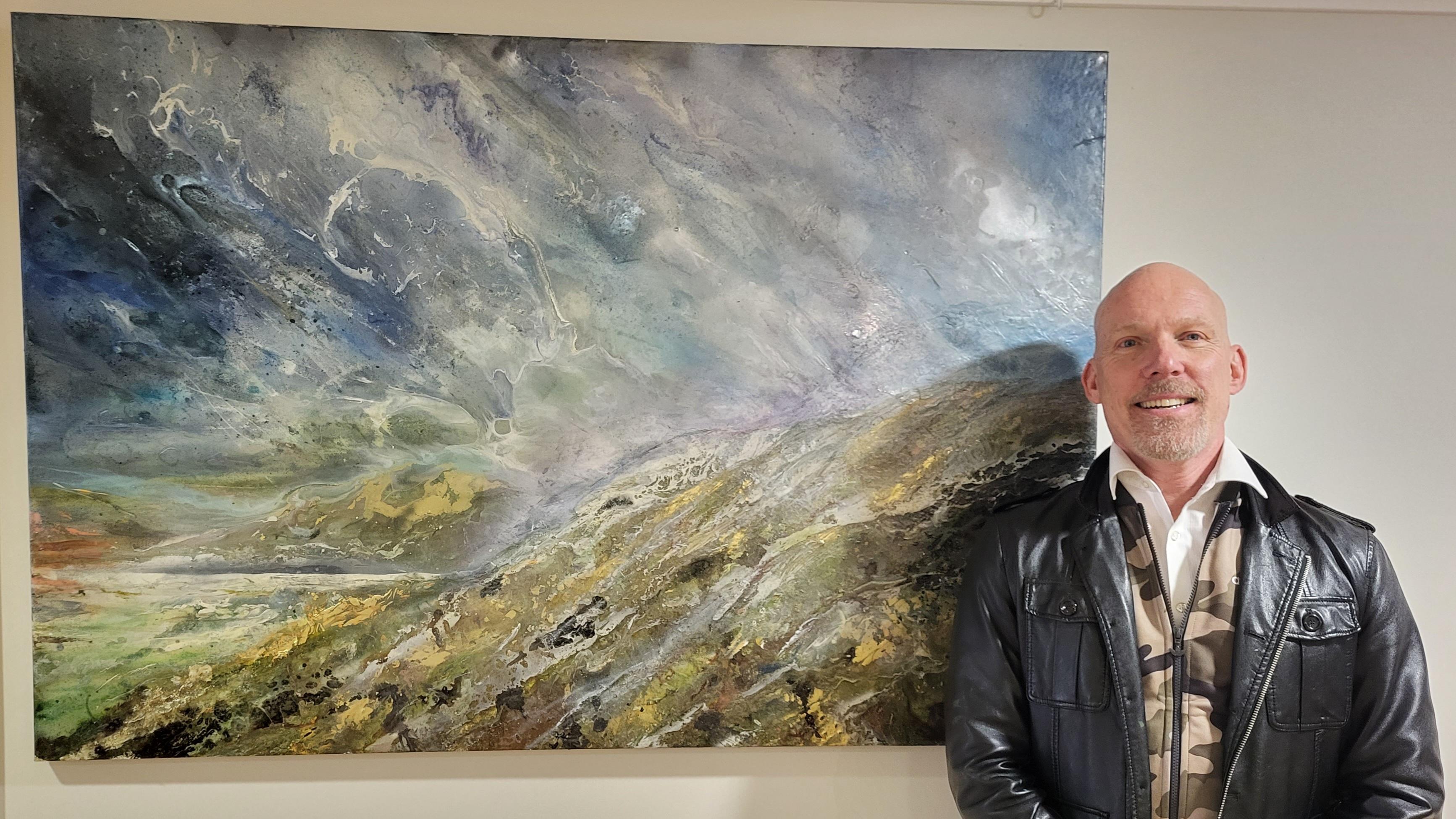 Shane McCoubrey with his painting Storm Approaching Roundway Down