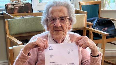 Barbara with some tokens of thanks to mark her participation in World Thinking Day 2025
