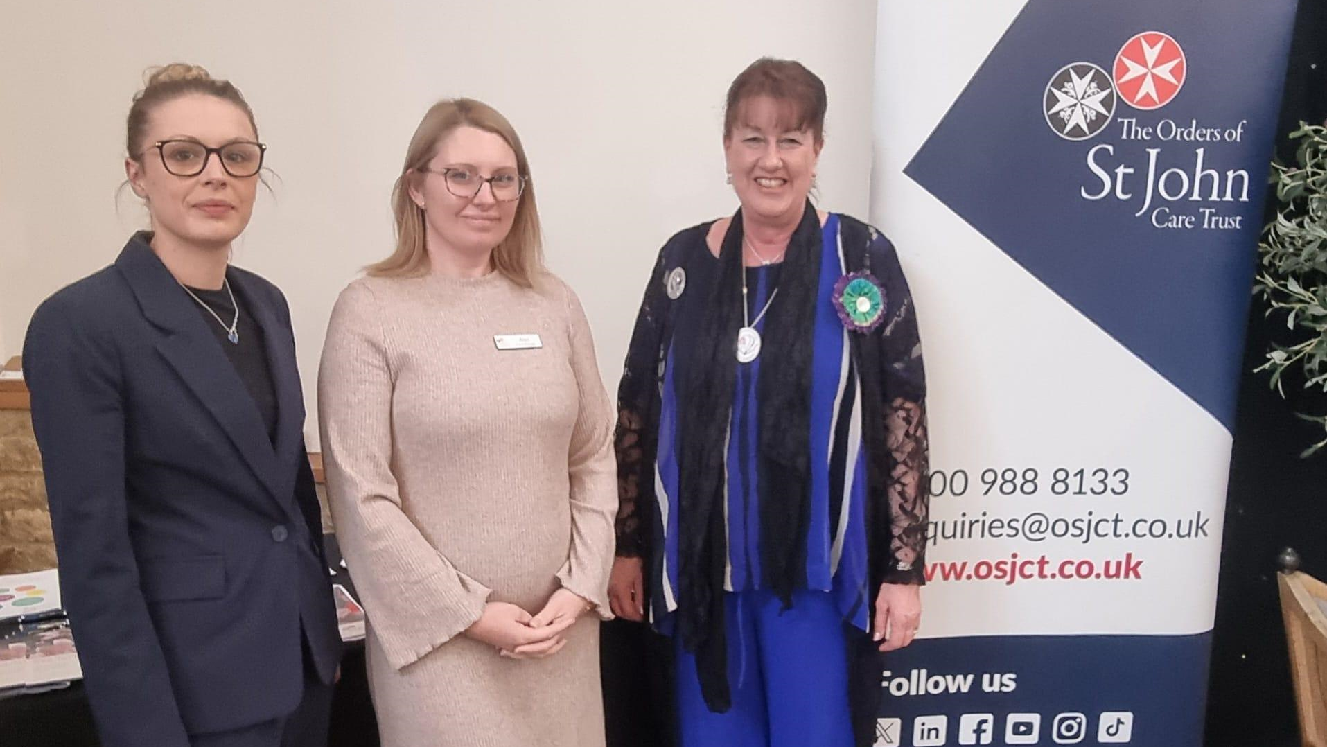 Angela Champ and Alexandra Grindle from OSJCT alongside Sally Scott, former High Sheriff of Oxfordshire at the WI AGM 2025