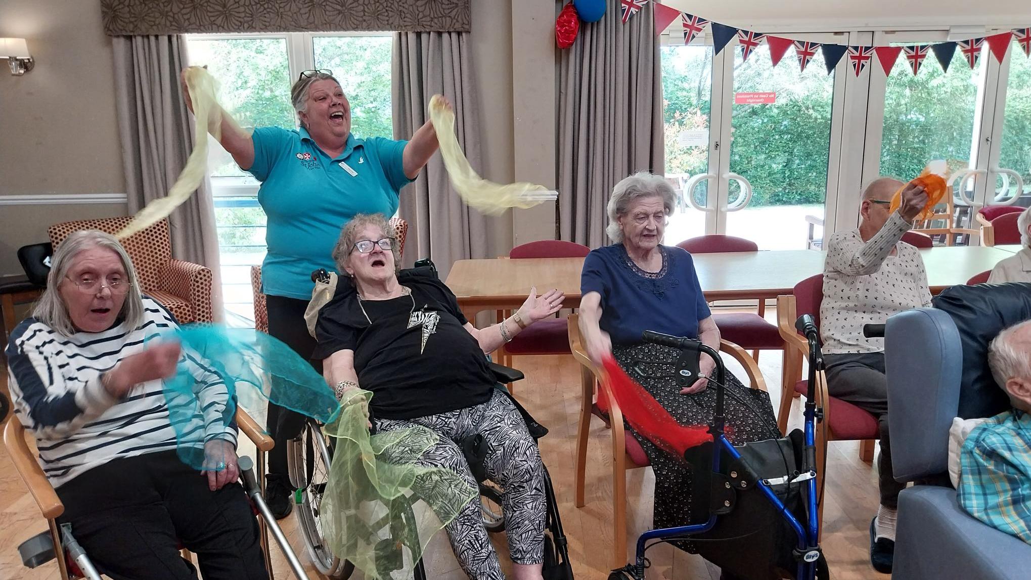 Residents at Isis House enjoying singing and dancing with Musical Moments