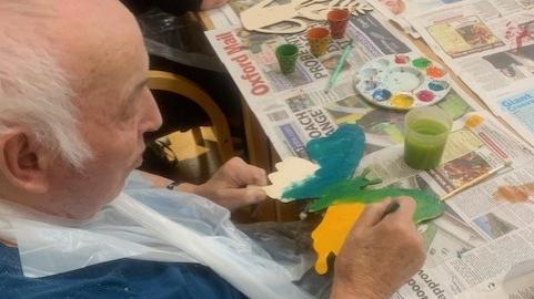 Residents painting at new Arts and Crafts club