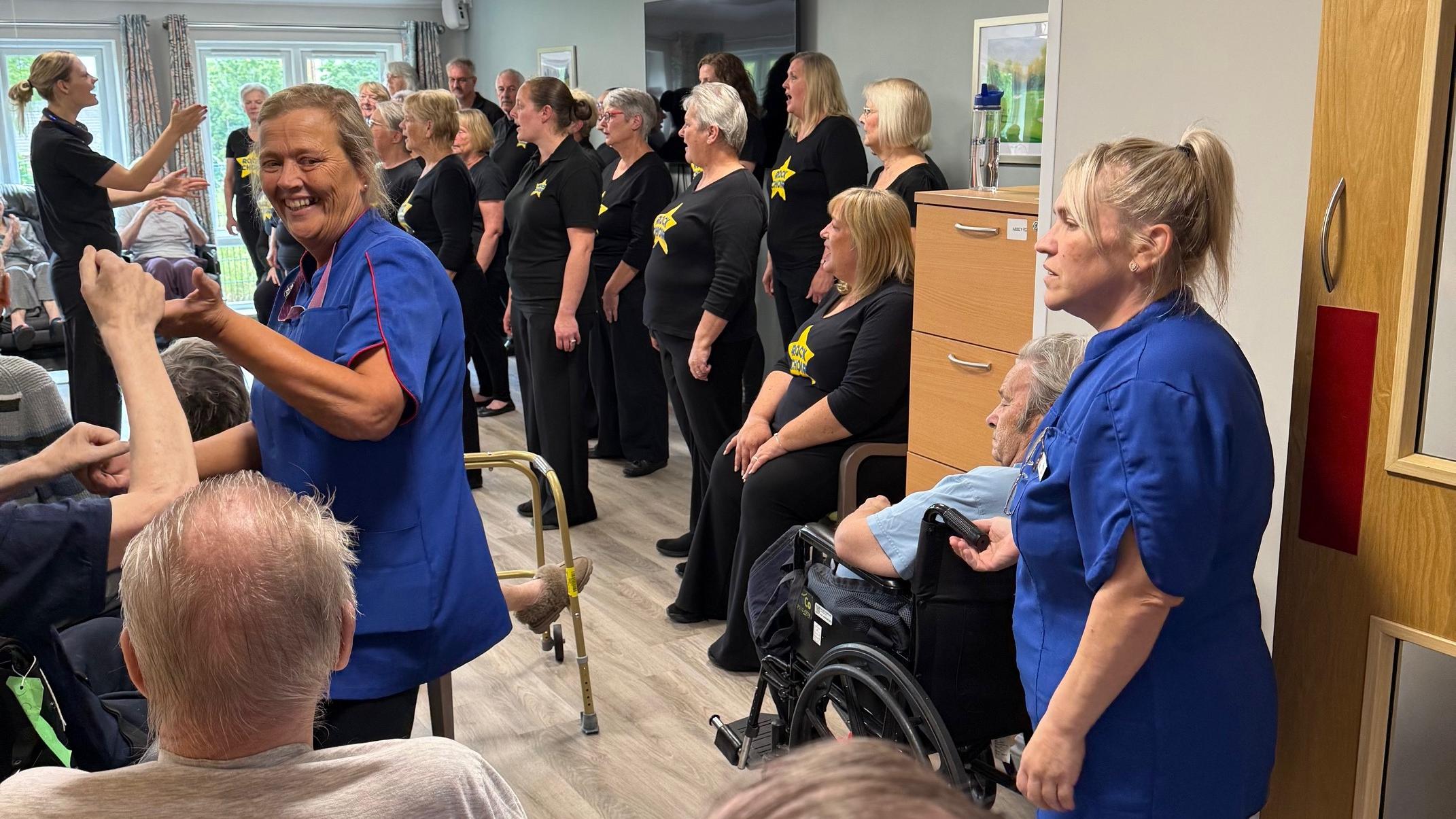 Tracey and Kelly join residents in the singing and dancing