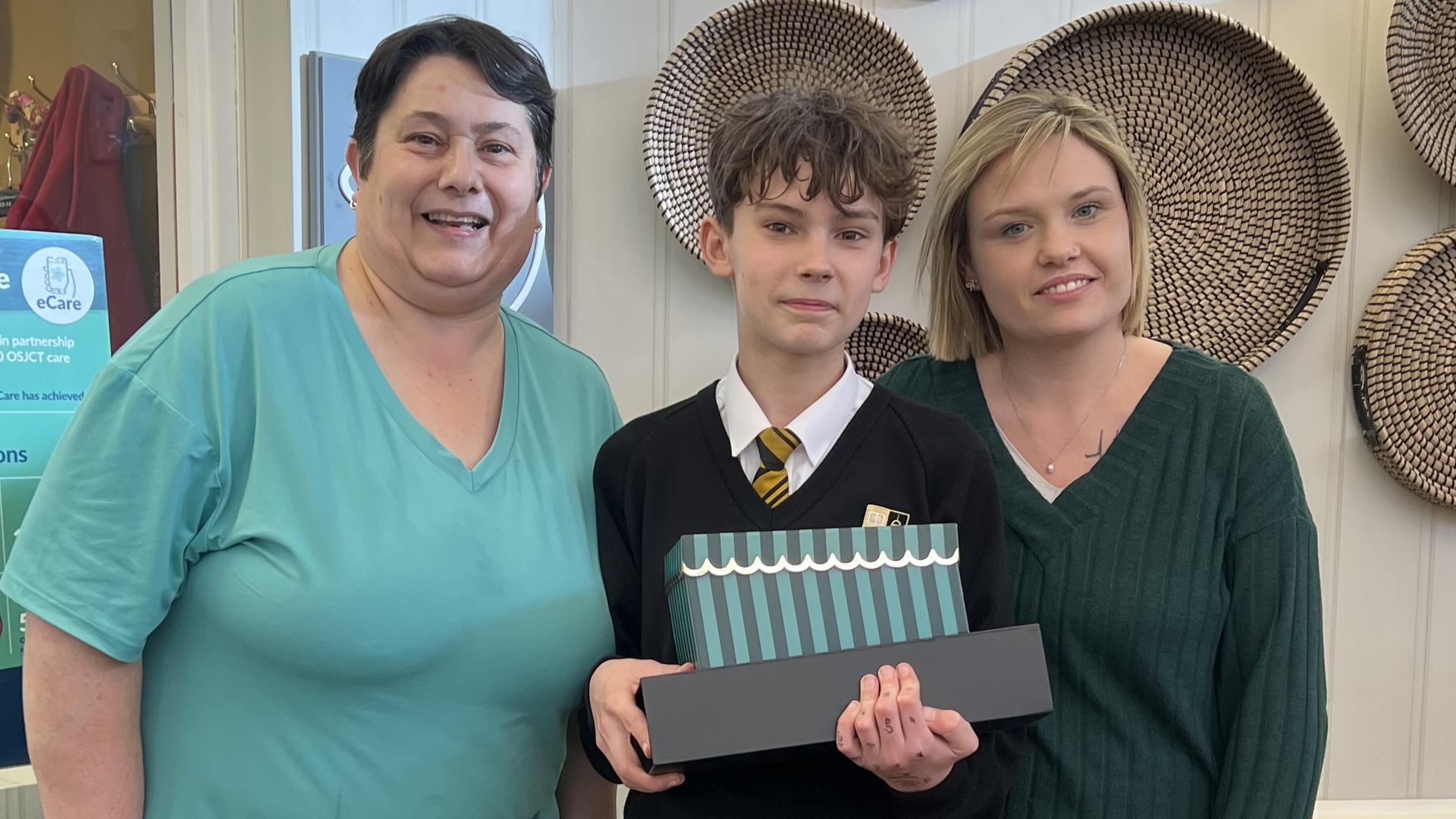 Young volunteer showcases memory boxes for residents at Henry Cornish Care Centre