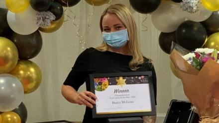 Beata collecting her award