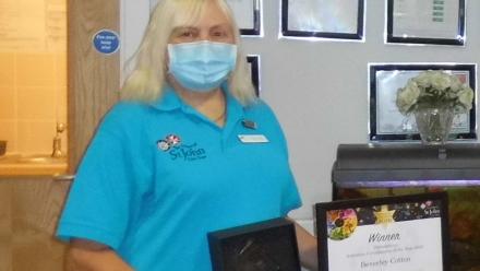 Beverley receiving her Award