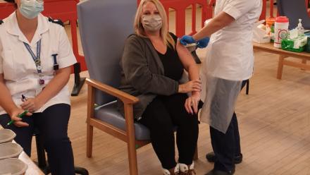 Andrea Brooks, Home Manager at OSJCT Beckside, is pictured having her vaccination 