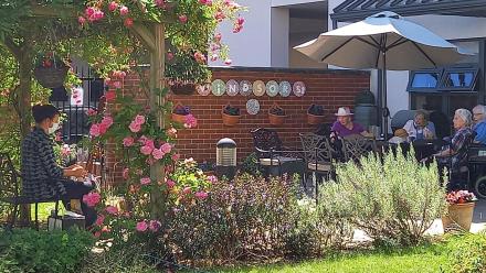 Rudy Green performs for residents in Windsor Street Care Centre's garden