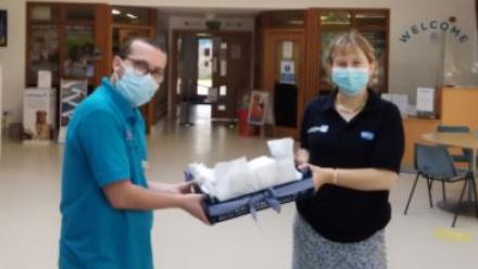 Alex presents dog biscuits