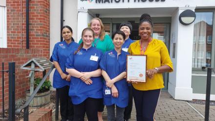 Manager Hilda with Mayott House team members