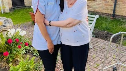 Nurse Maricar Padaguan and resident Barbara Carpenter, age 86, at Grevill House