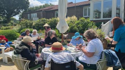 Coombe End Court residents enjoy National Garden Scheme open garden in Manton