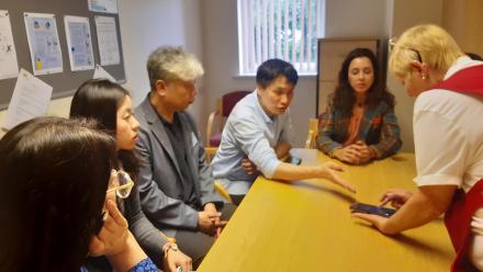 Carer Beve demonstrates eCare to South Korean delegation during special visit to care homes
