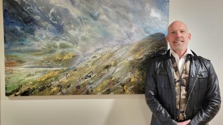 Shane McCoubrey with his painting Storm Approaching Roundway Down