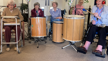 Goodson Lodge residents playing Samba drums