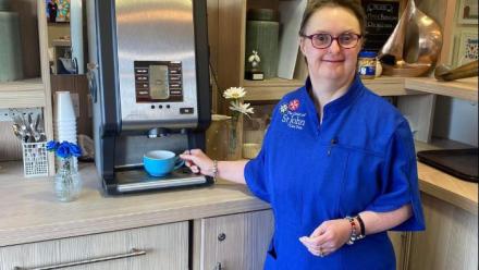 Sandra at the coffee machine helping out