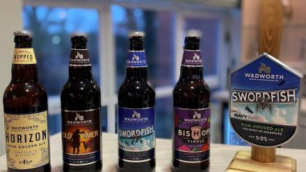 A range of beers on a bar