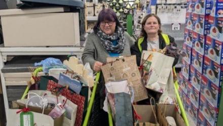 Joanna Dixon, Activity Coordinator, Lake House and Laura from Dunelm with the Dunelm Christmas presents for Lake House residents.