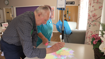 Lake House resident John Loveridge interacting with the Happiness Programme light projector