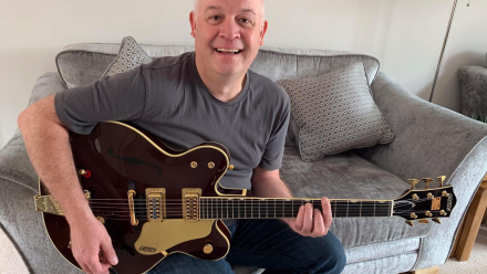 Les Johnson with his guitar