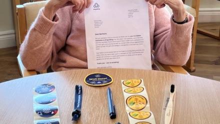 Barbara with some tokens of thanks to mark her participation in World Thinking Day 2025