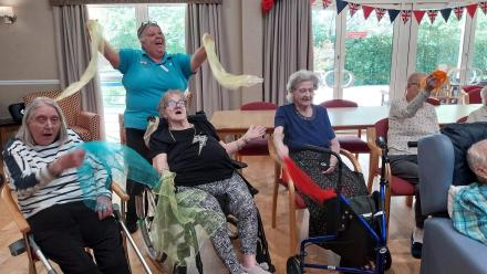 Residents at Isis House enjoying singing and dancing with Musical Moments