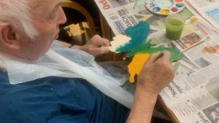 Residents painting at new Arts and Crafts club