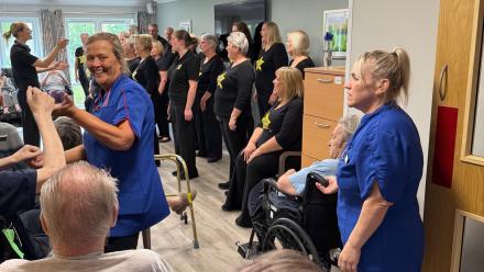 Tracey and Kelly join residents in the singing and dancing
