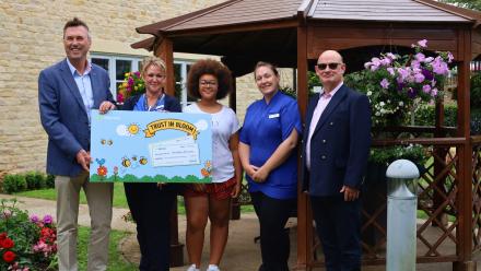 Edwardstow Court team members and volunteers with representatives from sponsors Maintel