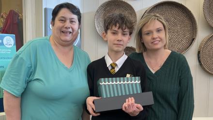 Young volunteer showcases memory boxes for residents at Henry Cornish Care Centre