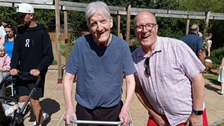 Resident Bill enjoying summer fete with his son